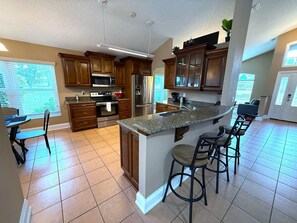 Fridge, microwave, oven, stovetop - 7th Tee - Southern Dunes Pool Home (Haines City)