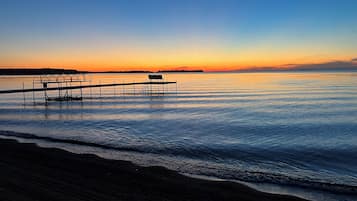 On the beach, sun loungers, beach towels