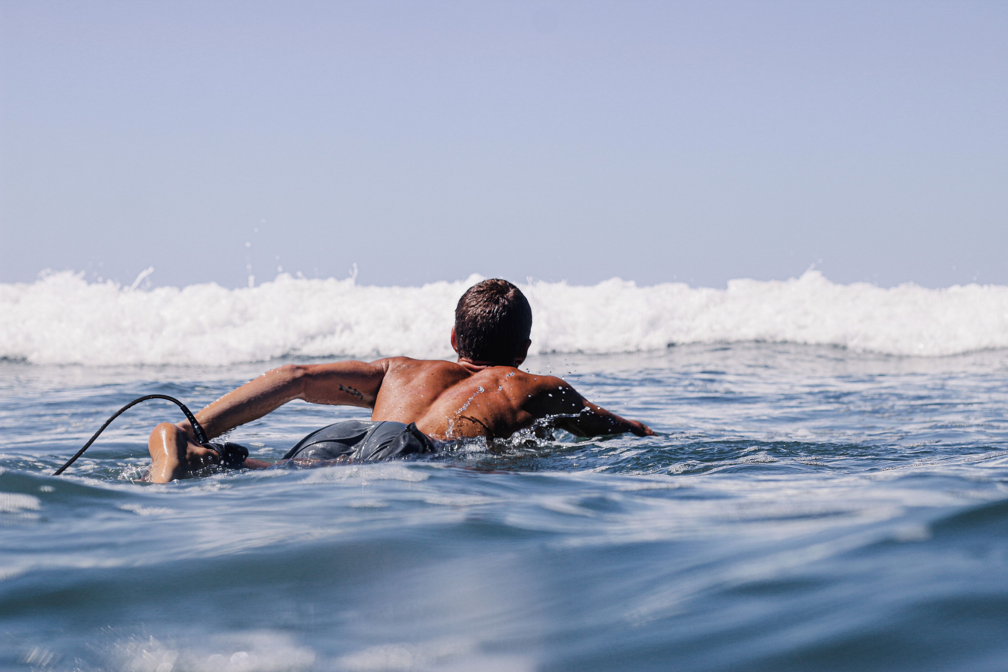 A person surfing in the ocean.