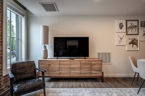 Deluxe Suite, 1 Queen Bed with Sofa bed, Kitchen, City View | Living area | 60-inch Smart TV with cable channels