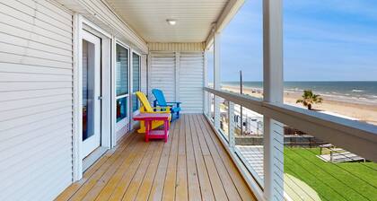 Galveston home with open floor, balcony, patio and water views