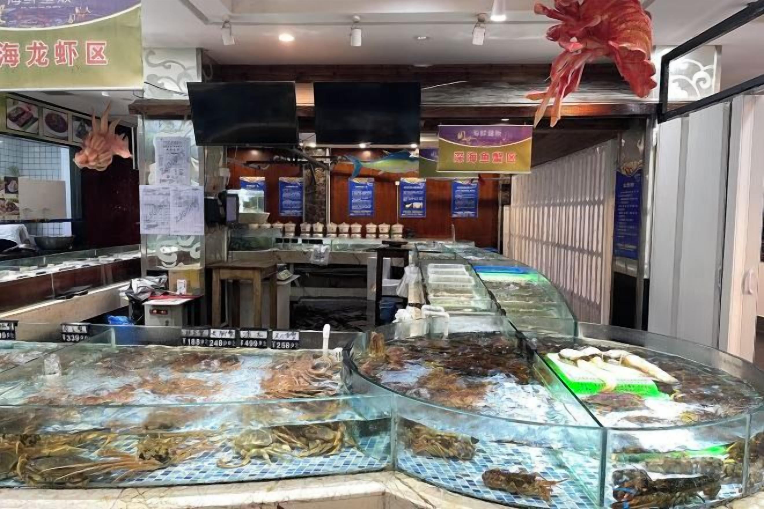 A seafood market with glass display cases filled with various seafood items.