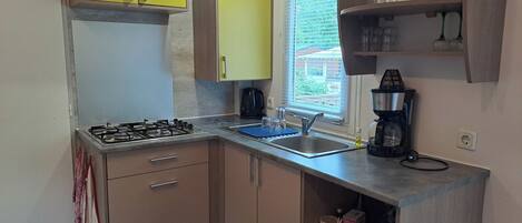 Fridge, microwave, stovetop, coffee/tea maker