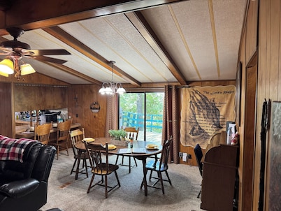 Quiet cabin in the woods w/ access to pools, river, & lakes in gated community!!