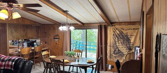 Quiet cabin in the woods w/ access to pools, river, & lakes in gated community!!