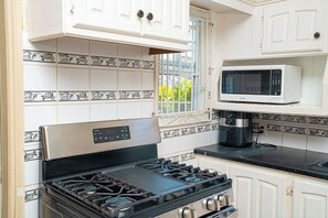 Fridge, microwave, stovetop, cookware/dishes/utensils - Sol Springs Villa #80 (Osbourn)