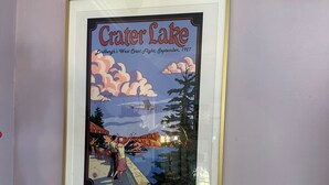 A framed picture of Crater Lake with a caption, and a smaller framed map below it. - Cherry's Villa 14 (Grants Pass)