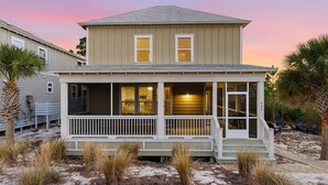 A two-story house with a porch, a garage, and a number 607 sign. - Spacious 4BR w/ Pool Access|Walk to Beach|Fire Pit (Port St. Joe)