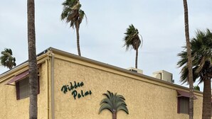 A building with a sign reading "Kiddie Palms." - Cute Condo in Downtown Area! (Lake Havasu City)