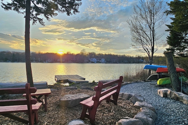 Lakeside firepit with sunset views—perfect for relaxing by the water.