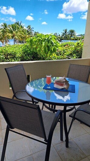 Outdoor dining - Breathtaking Ocean Views Condo with Private Beach Access. (Christiansted)