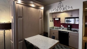 A compact kitchen with a dining area, equipped with a refrigerator, microwave, and coffee maker. - Studio for 2 at Purgatory Resort in the main plaza buildings (Durango)