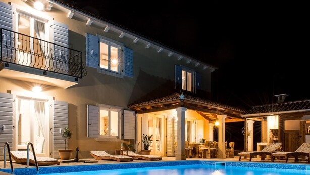 A two-story house with a swimming pool, outdoor seating area, and a covered patio. - Lovely home in Smoljanci (Smoljanci)