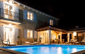 A two-story house with a swimming pool, outdoor seating area, and a covered patio. - Lovely home in Smoljanci (Smoljanci)