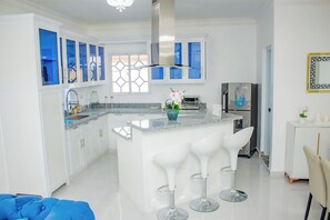 Fridge, microwave, stovetop, coffee/tea maker