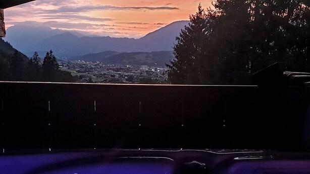 A hot tub with a view of a town and mountains in the background. - zur schönen Aussicht by Interhome (Wörgl)