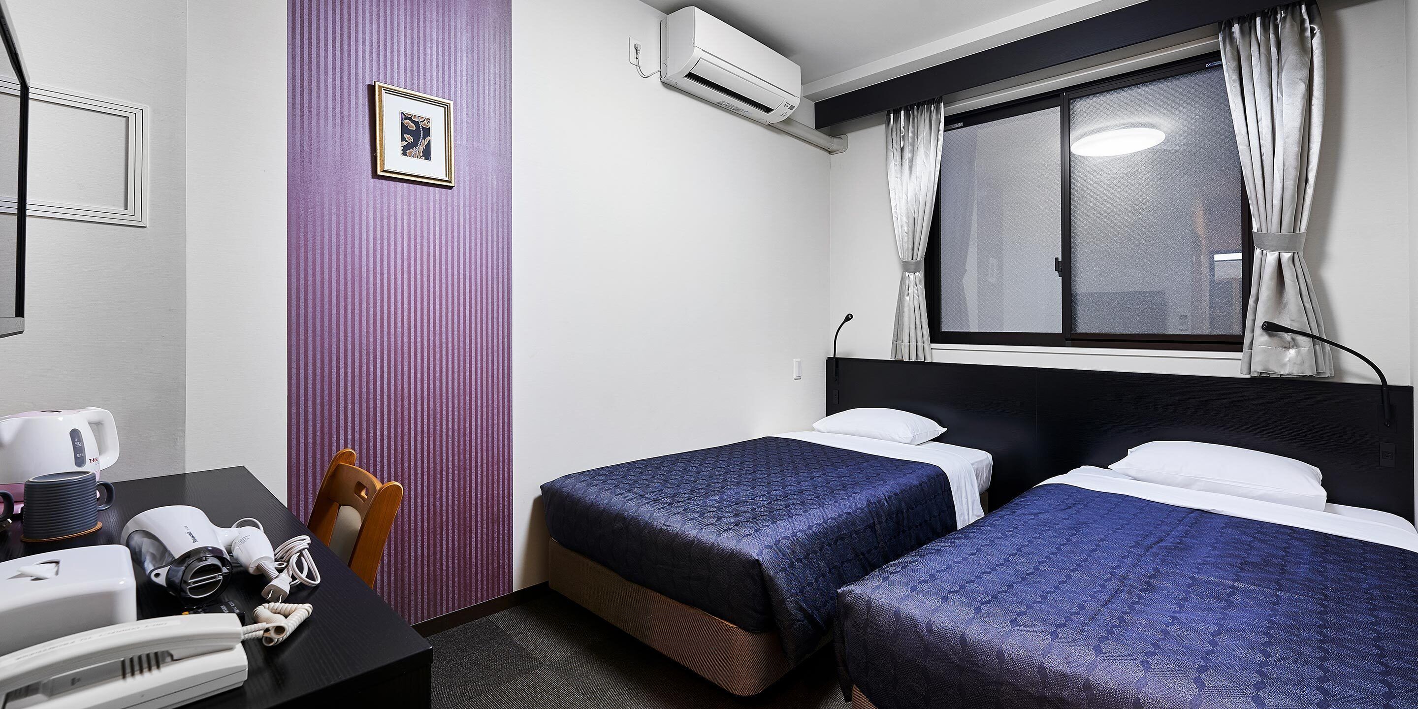 Kamar Twin Standar | Bantalan ekstra lembut, meja kerja, Wi-Fi gratis, dan seprai linen