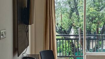 Deluxe Double Room | Living area | 32-inch LCD TV with digital channels