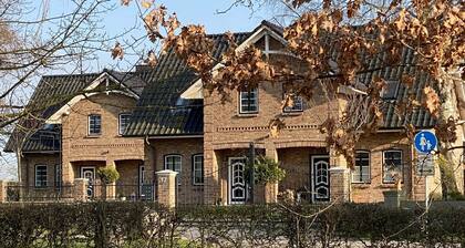 Ferienhaus 'Haus Am Dorfteich B Eingefriedet' mit privater Terrasse, Gemeinschaftsgarten und WLAN