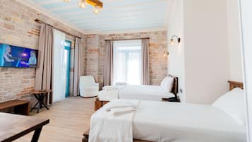 Habitación triple Deluxe | Sábanas de algodón egipcio y ropa de cama de alta calidad