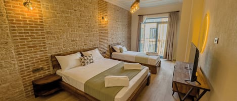 Superior Triple Room, Balcony, Partial Sea View | Egyptian cotton sheets, premium bedding, Select Comfort beds