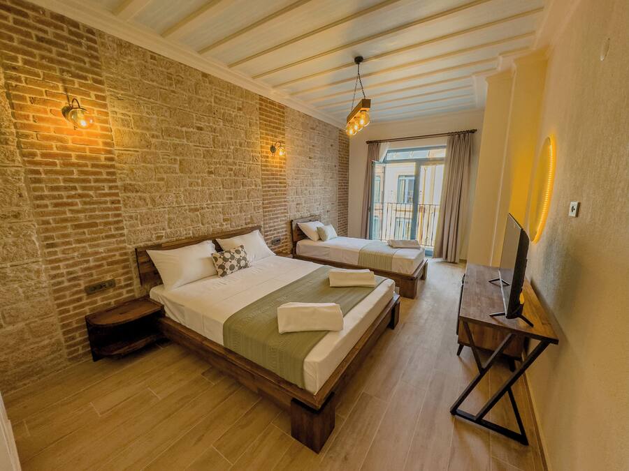 Superior Triple Room, Balcony, Partial Sea View | Egyptian cotton sheets, premium bedding, Select Comfort beds