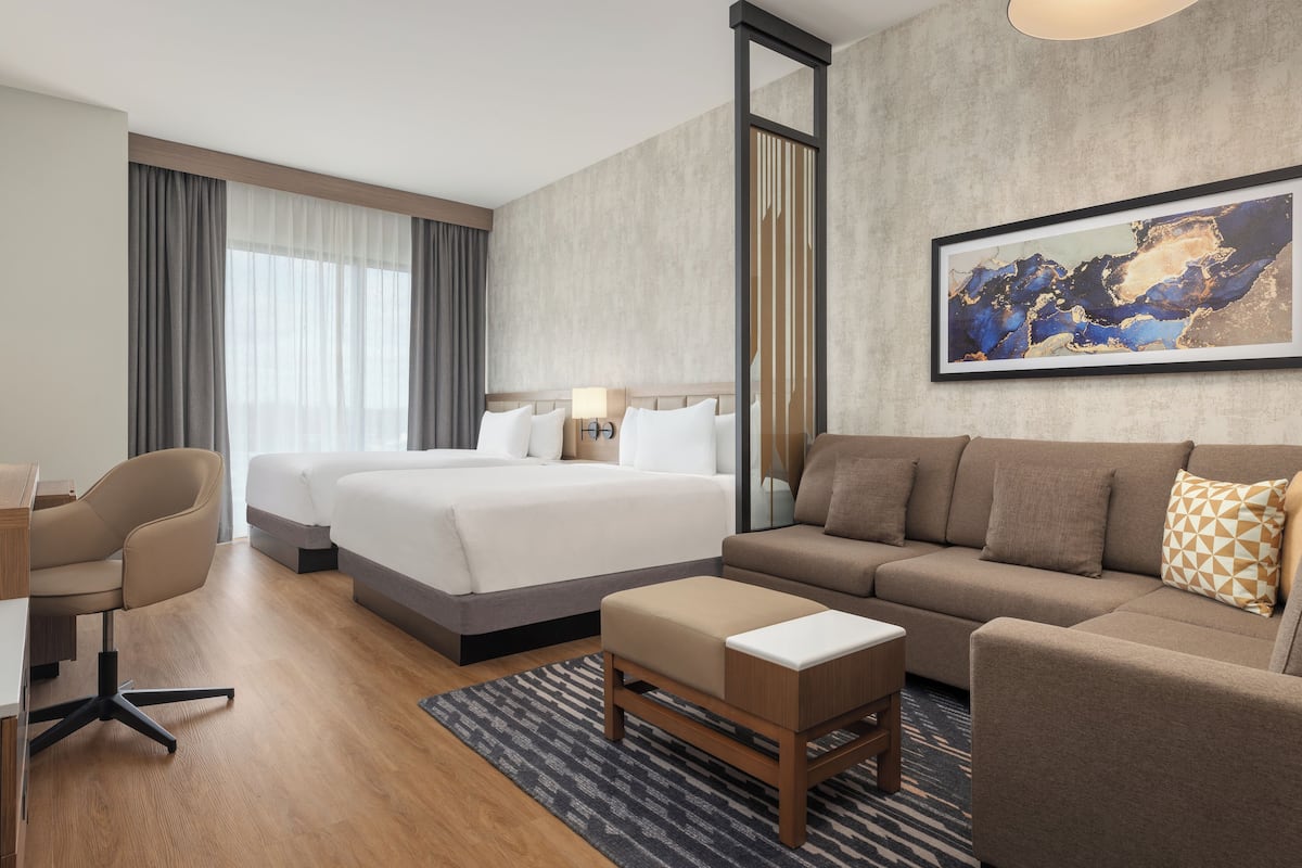 Room (Specialty 2 Queen Beds with Sofa Bed) | In-room safe, blackout drapes, iron/ironing board, free WiFi