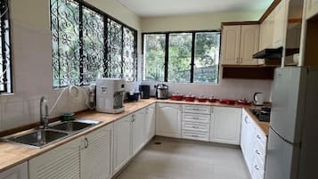 Executive Villa, Garden View | Private kitchen | Microwave, stovetop, coffee/tea maker, electric kettle