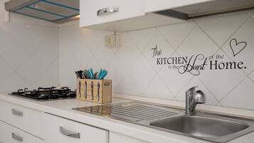 Apartment | Private kitchen | Full-size fridge, oven, stovetop, dishwasher