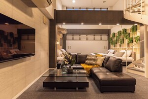 Design Loft, 2 Bedrooms, Non Smoking | Living area | 60-inch flat-screen TV with digital channels