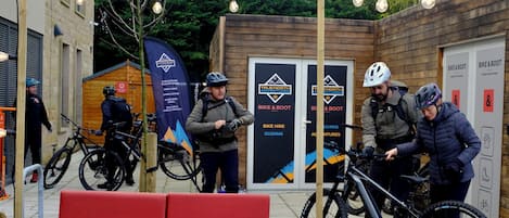 A wooden building with signs for 'True North Adventures' and 'Bike & Boot' services.