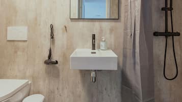 Standard Studio | Bathroom | Shower, hair dryer, towels, soap