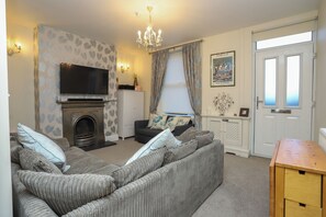 Smart TV, fireplace, DVD player, books