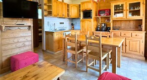 Enjoy cooking and dining in this fully equipped kitchen with a microwave, coffee maker, and ample utensils.