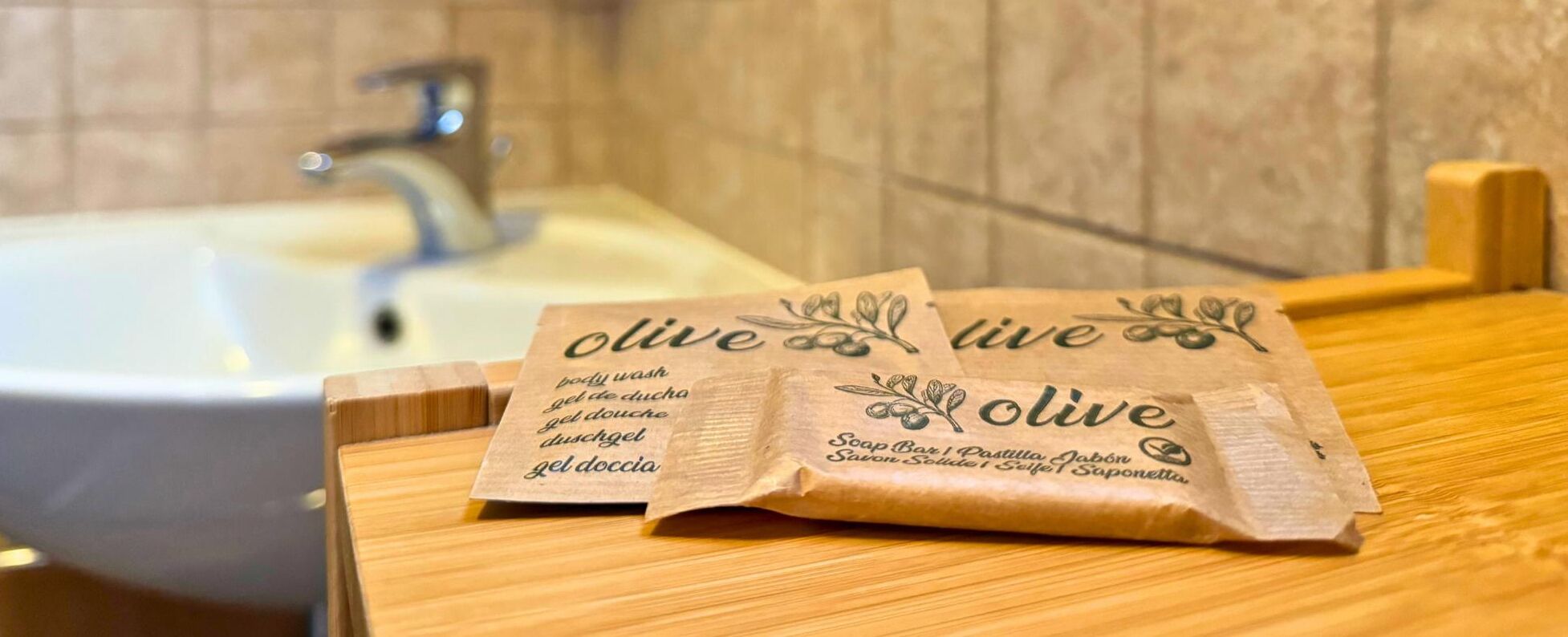 A bathroom with a sink and toiletries.