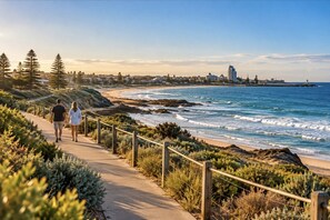 Coastal lifestyle, people enjoying a walk along Bunbury’s coastal path, with local scenery.