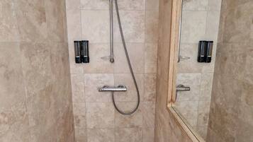 Shower, hair dryer, towels, shampoo