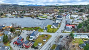 A coastal town with a marina, houses, and a road leading to a main street. - Bear`s Den *ATV Access*Walk to Town/Bars/Restaurants*A/C*Pet Friendly (Greenville)