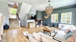 TV, fireplace, books, offices