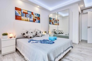 4 slaapkamers, een strijkplank/strijkijzer, beddengoed