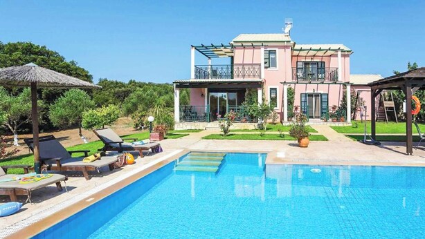 A two-story house with a swimming pool, a covered patio, and a garden. - Villa Carreta (Corfu)