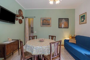 Family Apartment, Multiple Bedrooms (Casa Caterina) | Living area | 21-inch flat-screen TV with cable channels