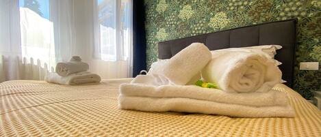Superior Quadruple Room | 1 bedroom, down comforters, pillowtop beds, individually decorated