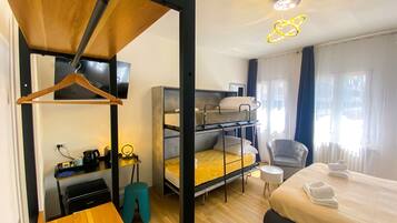 Superior Quadruple Room | 1 bedroom, down comforters, pillowtop beds, individually decorated