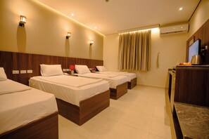 Comfort Quadruple Room | Premium bedding, down comforters, in-room safe, desk