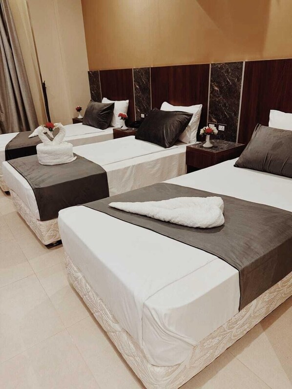Premium bedding, down comforters, in-room safe, desk