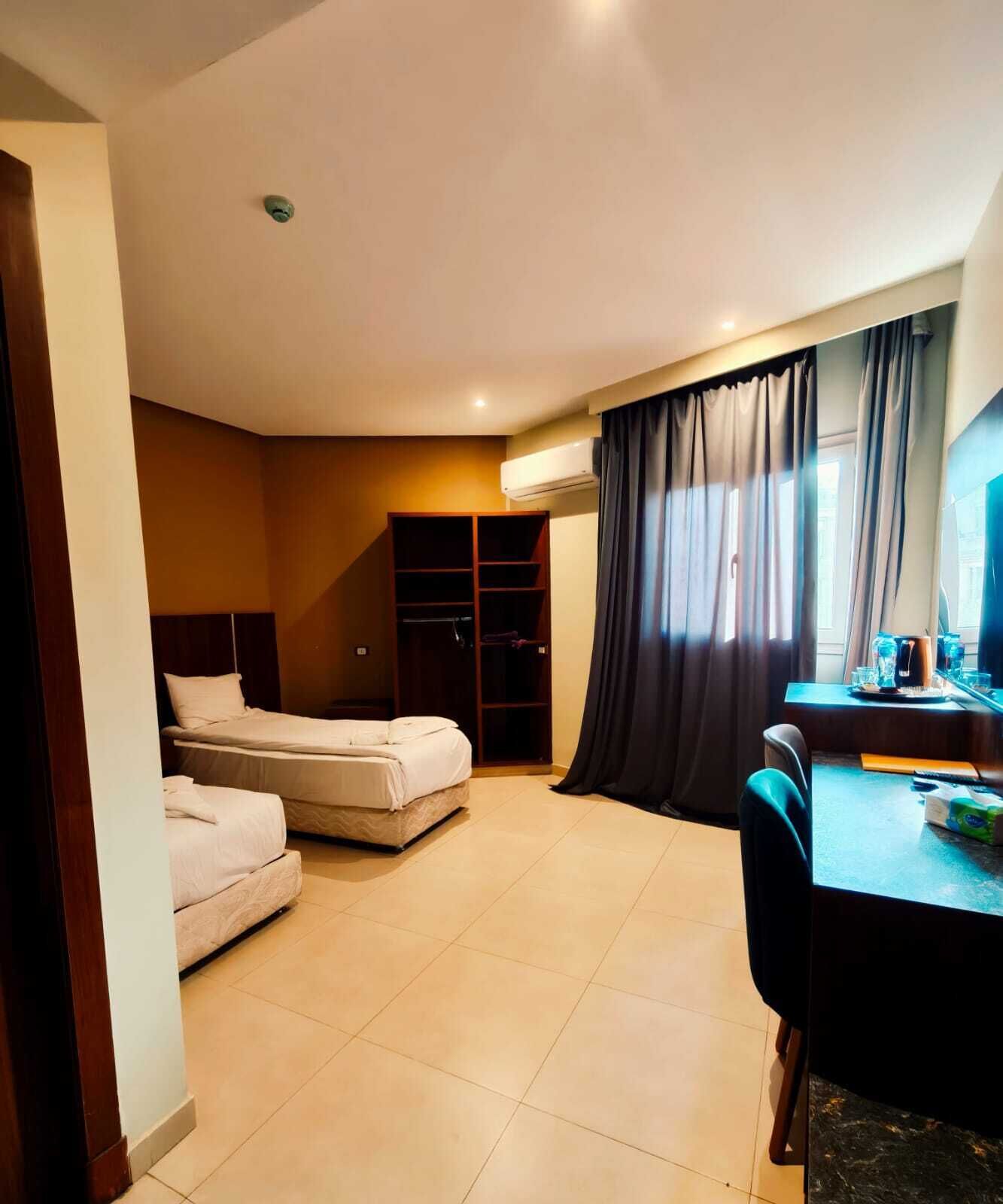 Room | Premium bedding, down comforters, in-room safe, desk
