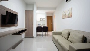 Deluxe Apartment, Balcony, Courtyard View | Living room | 32-inch flat-screen TV with digital channels