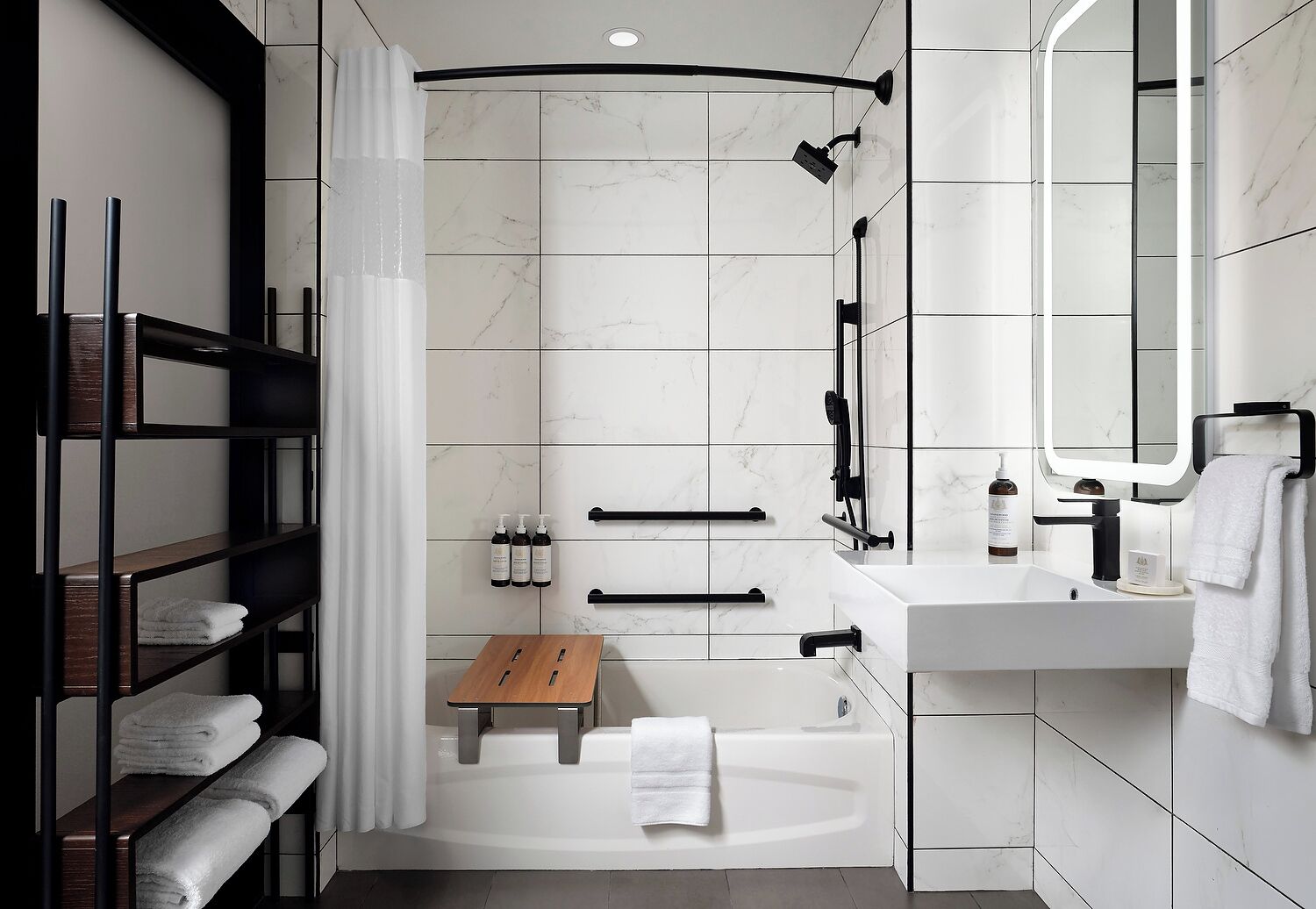 A modern bathroom with a shower, bathtub, and vanity.