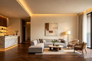 A modern hotel lobby with a reception desk, a sectional sofa, a round coffee table, and a floor lamp. - Westcare Hotel (Century City New Convention and Exhibition Center Tianfu 3rd Street Store) (Chengdu)